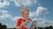 Little boy reading a book
