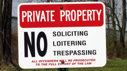 A sign that says private property soliciting policy.