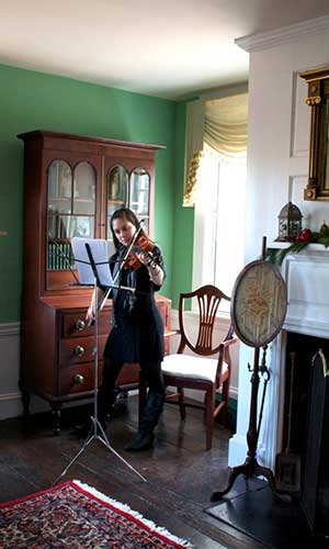 In the parlor Emma Sevigny will present seasonal musical selections on the viola 