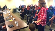 Milton resident Jen Goonan and her son attend the Sept 15. Massport board meeting to voice concerns of plane abuse