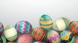 Colorful easter eggs on a gray background.