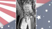 A photo of a woman with an american flag background.