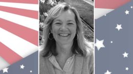 A photo of a woman with an american flag background.