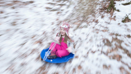 Child sledding in winter, Photo by Melissa Fassel Dunn. All rights reserved