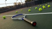 A tennis racket on a tennis court.
