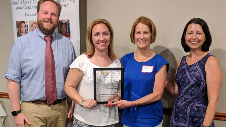 Jennifer Reale, second from left, and Beverly Tangvik, third from left accepted the honor on behalf of Arbella. Interfaith’s executive director Rick Doane, left, and Director of Development Paula Daniels, right, bestowed the award.  Credit – Courtesy Interfaith Social Services