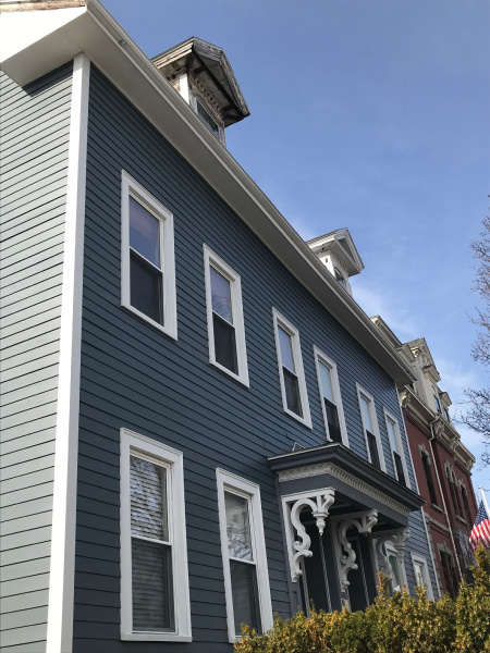 Capital Construction is thrilled to offer expert James Hardie siding installations for various projects. Our team of experienced professionals is skilled in transforming houses with blue siding and white trim into stunning homes. From residential to commercial