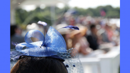 A woman wearing a blue hat will be featured at the "Head to Toe: Hat and Shoe Fashions from Historic New England" exhibit held at Eustis Estate.