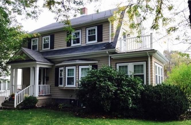 HOME FOR SALE: 39 Hurlcroft Road,Milton MA - A house with a porch and a deck.
