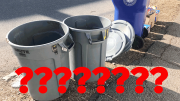 Milton residents bewildered by neatly arranged trash barrels