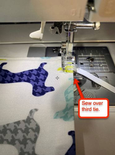 Sew over third tie and to corner and turn securing elastic/tie: