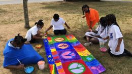 Milton residents Timothy O'Sullivan, Connor Finn, and Leah Medicke helped to create the panel of Love.