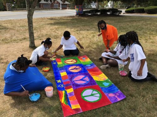 Milton residents Timothy O'Sullivan, Connor Finn, and Leah Medicke helped to create the panel of Love.