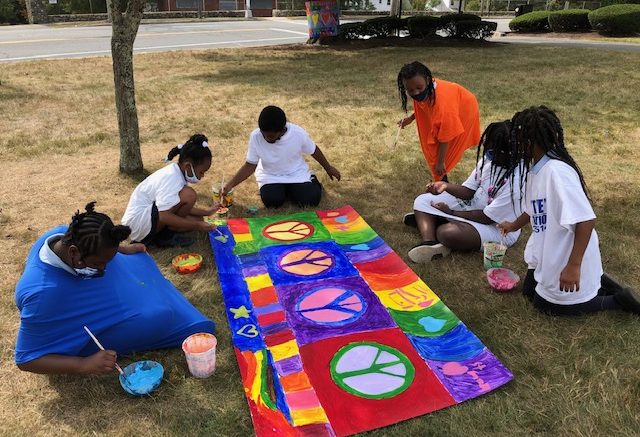 Milton residents Timothy O'Sullivan, Connor Finn, and Leah Medicke helped to create the panel of Love.