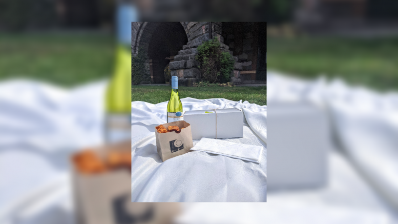 Eustis Estate offers sunset picnic and tour on October 9, 2020, with a bottle of wine on the blanket.