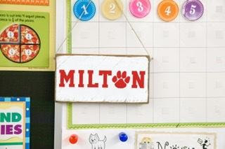 A Milton Public Schools bulletin board with the name "Milton" on it.