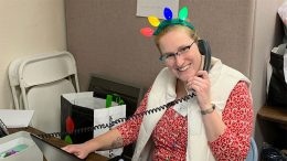 Interfaith Social Services’ Family and Children Program Coordinator Emily Ryan takes calls about Interfaith’s Help for the Holidays program last winter. The agency is seeking sponsors to provide holiday gifts for 700 children this season.
