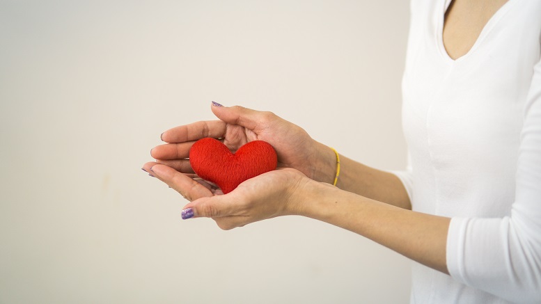 woman holding heart