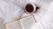 book in bed with tea