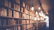 books in old bookstore with beautiful hanging lights