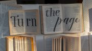 open books with large "turn the page" text