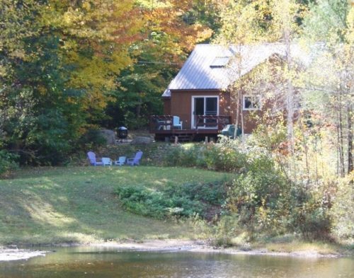 A White Mountain cabin in NH, a relaxing family retreat with pond and mountain views.