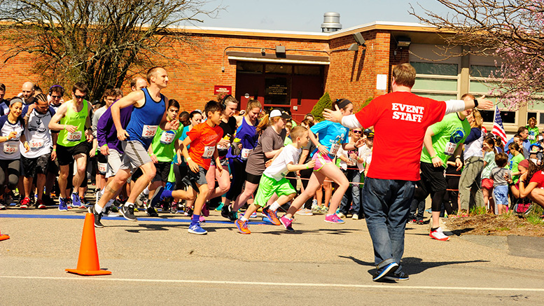 Runners take off at the start of a previous Stop the Stigma 5K race. Interfaith Social Services’ annual 5K raises funds for their New Directions Counseling Center. This year’s in-person race will be April 30 at the Kennedy Center in North Quincy. Credit - Hurley Event Photography