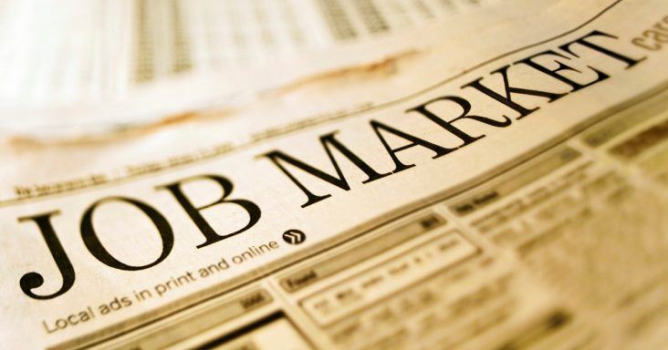 A newspaper with the word job market, emphasizing the importance of hiring the right people for small business success.