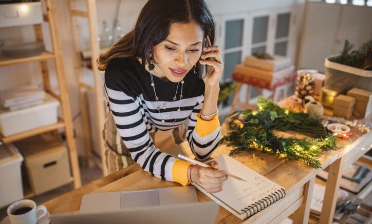 Woman on phone at business