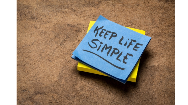 A sticky note with the words "keep life simple" on it, reminding us of the importance of living a simple life in a digital age.