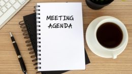 Meeting Agenda notepad for meeting notes, with computer and coffee. Image: canva