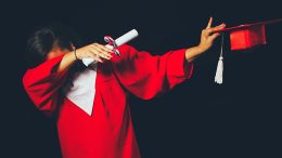 Graduate in red robe.