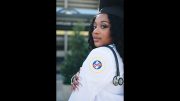 A woman on her journey to become a nurse is posing with a stethoscope.