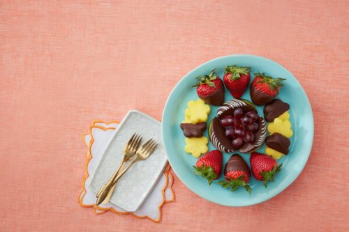 An Edible Arrangements plate with fruit and chocolate, perfect for a Sweet love or Valentine's Day gift.