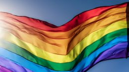 A rainbow flag waves against a clear blue sky as Milton proclaims LGBTQ pride month, celebrating diversity and inclusion on May 28, 2024.