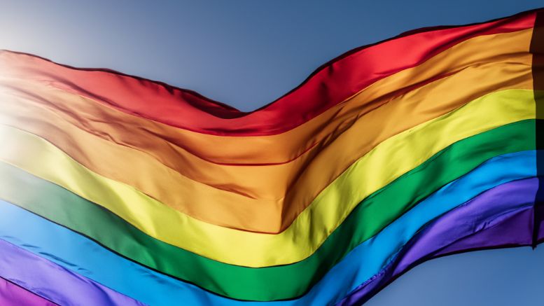A rainbow flag waves against a clear blue sky as Milton proclaims LGBTQ pride month, celebrating diversity and inclusion on May 28, 2024.
