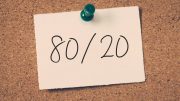 Note pinned to a corkboard with "80/20" written on it.