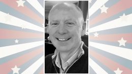 A smiling person in a black and white photo is centered on a background with stars and stripes in red, white, and blue.